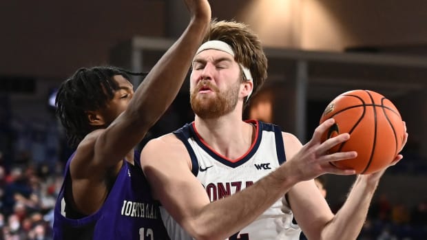 Dec 28, 2021; Spokane, Washington, USA; Gonzaga Bulldogs forward Drew Timme (2) shoots the ball against North Alabama Lion's forward Isaac Chatman (12) in the second half at McCarthey Athletic Center. Gonzaag won 93-63. Mandatory Credit: James Snook-USA TODAY Sports